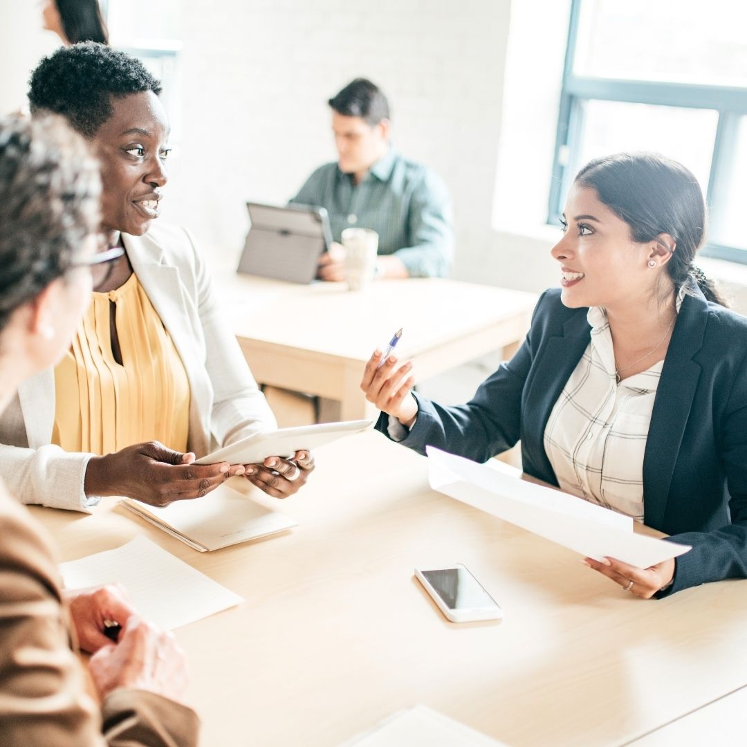 Group of professionals discussing at a table